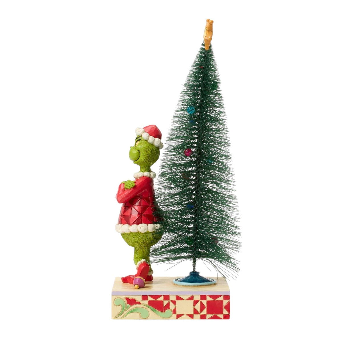 Grinch Stands in Front of the Tree